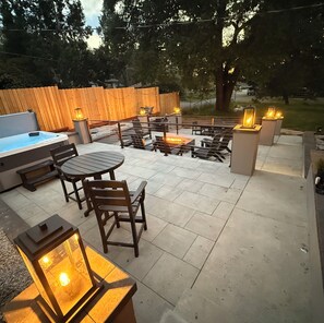 Relax in the hot tub or gather around the fire pit in this serene outdoor space.
