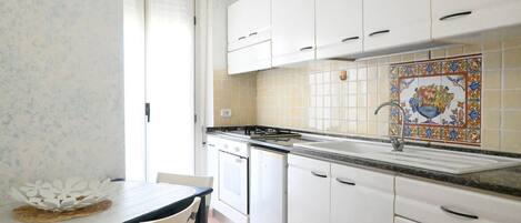 Fridge, oven, dining tables