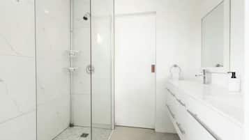Shower, hair dryer, towels, soap