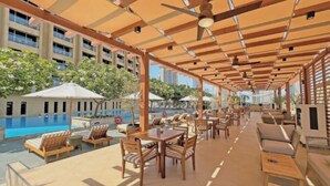 Outdoor dining - Chic 1-BR | Balcony City Views, Mall+Pool+Parking (Dubai)