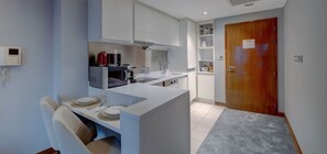 Fridge, microwave, stovetop, coffee/tea maker