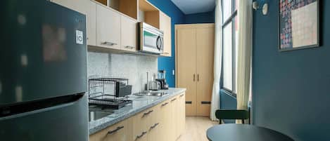 Microwave, coffee/tea maker, toaster, cookware/dishes/utensils