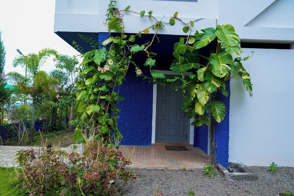A building with a blue exterior and a door.