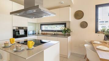 Family Apartment, Multiple Bedrooms, 2 Bathrooms (Luxury Jardinana Lotus 700m To Beach) | Private kitchen | Fridge, microwave, oven, stovetop