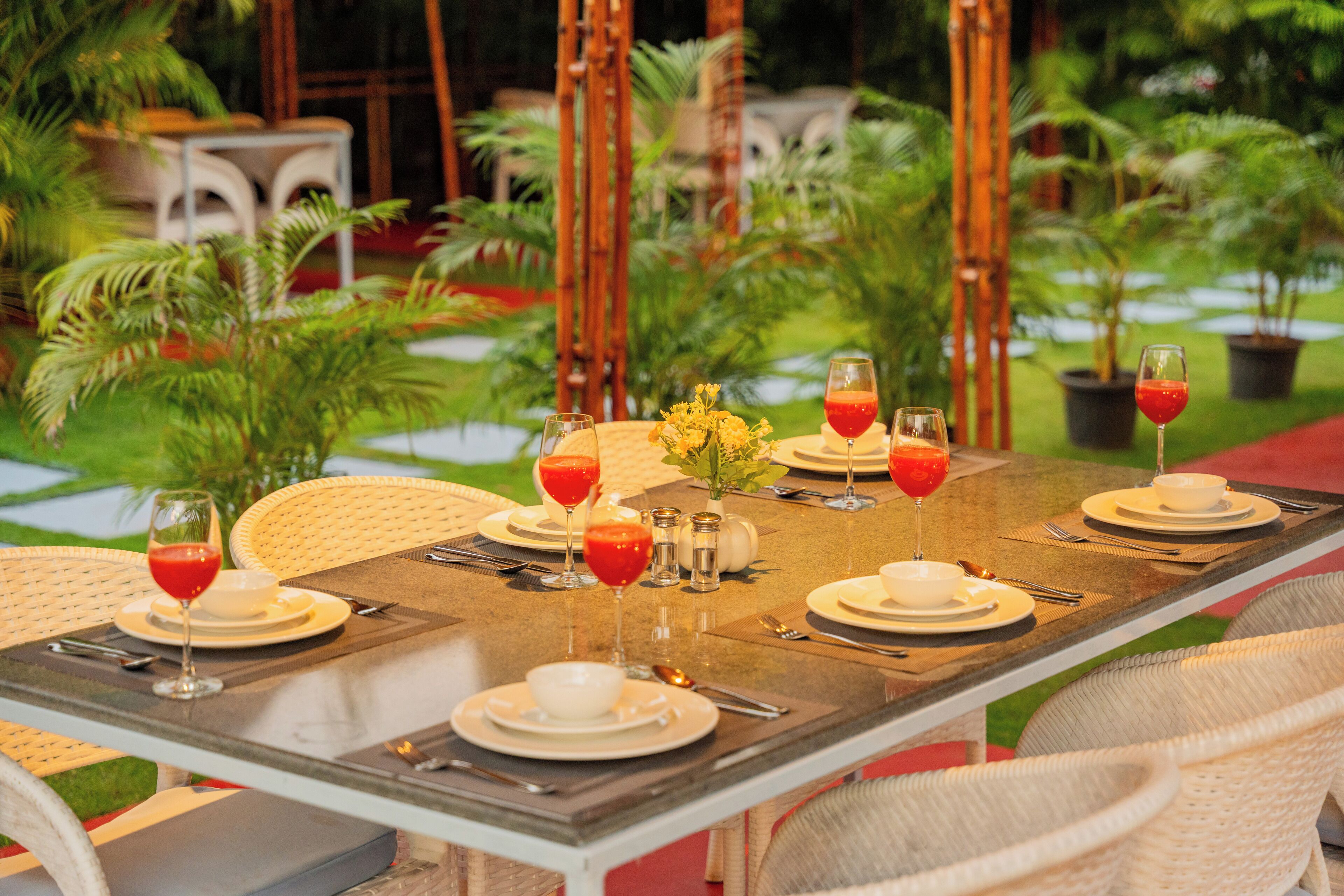 A table set for dining with plates, glasses, and cutlery.