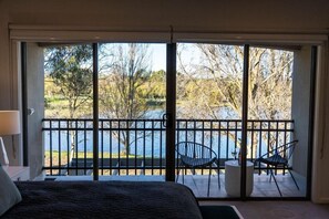 Desk, laptop workspace, blackout curtains, iron/ironing board