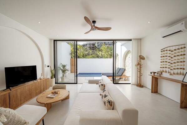 Junior Villa, Patio, Pool View | Living area | 50-inch Smart TV with cable channels