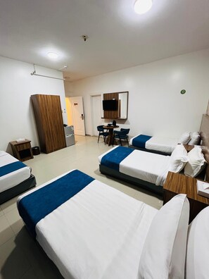 Deluxe Quadruple Room | In-room safe, individually decorated, individually furnished, desk