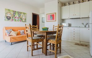 Classic Apartment | Living area | 32-inch flat-screen TV with digital channels
