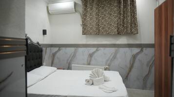 Economy Triple Room | Egyptian cotton sheets, premium bedding, down comforters, in-room safe