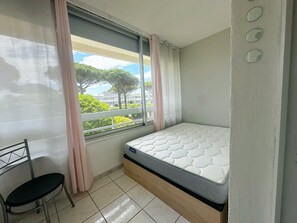 1 bedroom, desk, iron/ironing board, travel crib