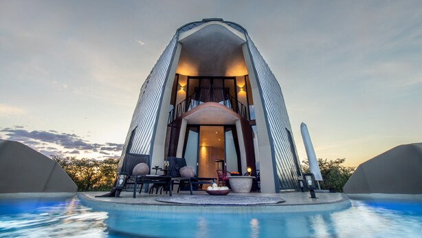 A modern building with a pool in front. - The Ekipa (Okaukuejo)
