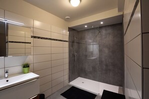 Shower, hair dryer, towels, toilet paper