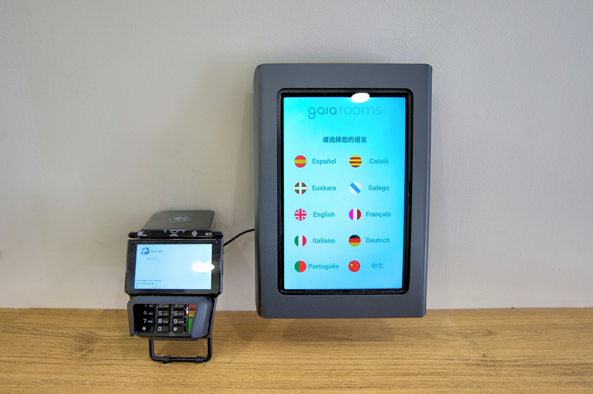 A mobile device displaying a language selection screen with various options including Español, Català, and others.