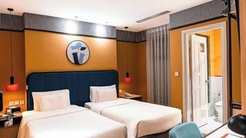 Deluxe Double Room | Minibar, in-room safe, desk, blackout drapes