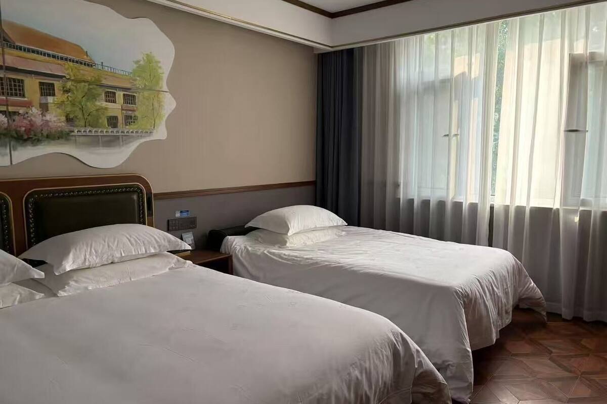 Family Triple Room | Free minibar, individually decorated, desk, laptop workspace
