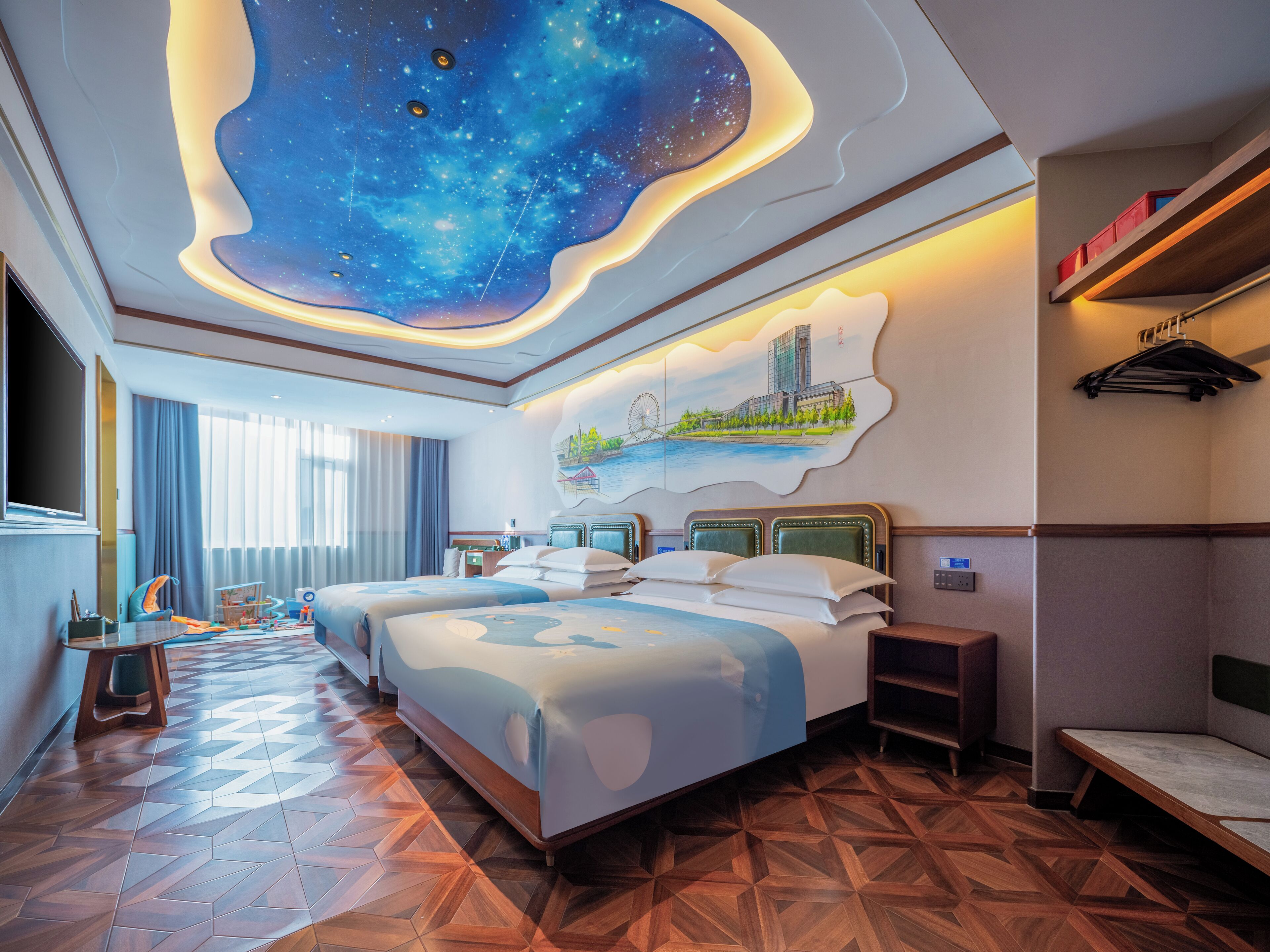 Family Quadruple Room | Free minibar, individually decorated, desk, laptop workspace