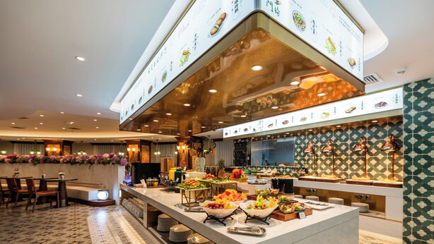 A buffet area with a variety of food items and a menu display. - Nostalgia S Hotel(Tianjin Jinwan Plaza) (Tianjin)