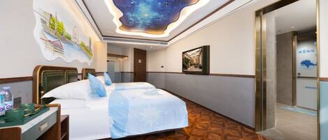 Family Quadruple Room | Free minibar, individually decorated, desk, laptop workspace