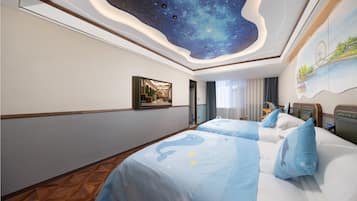 Family Quadruple Room | Free minibar, individually decorated, desk, laptop workspace