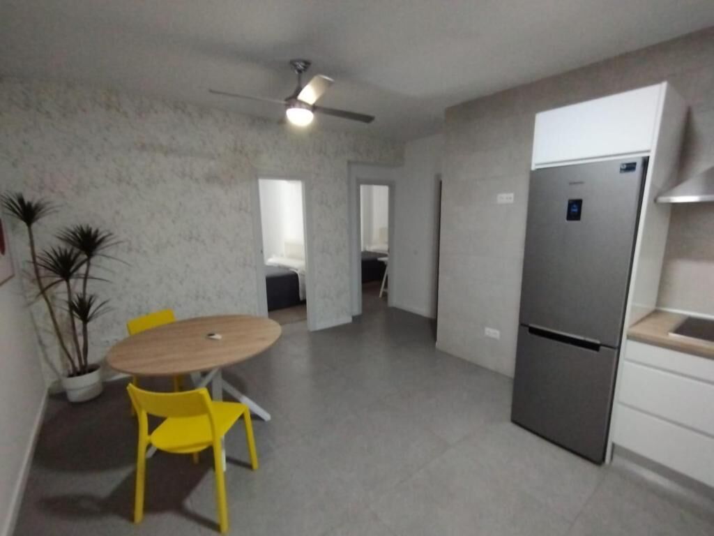 Family Apartment, Balcony | Private kitchen | Shared fridge, microwave, cookware/dishes/utensils, cleaning supplies