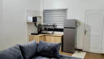 Comfort Apartment, Balcony, Beach View | In-room safe, blackout drapes, soundproofing, iron/ironing board