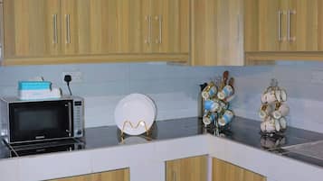 Fridge, microwave, cookware/dishes/utensils