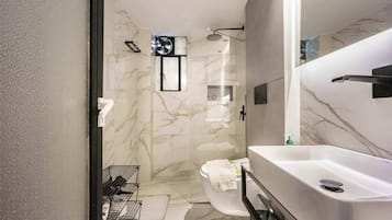 Shower, hair dryer, towels, shampoo