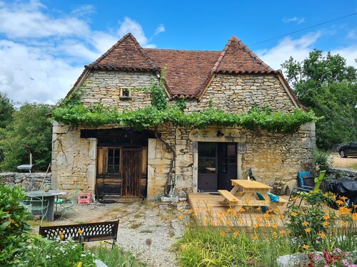 Large traditional stone house in peaceful countryside