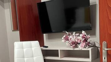 Superior Suite | Living area | Flat-screen TV