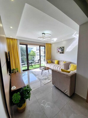 Executive Apartment, Balcony, City View | Living area