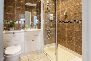 Shower, hair dryer, towels, soap