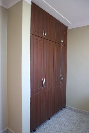 Ample storage space is provided by this large wardrobe with a secure chain lock.