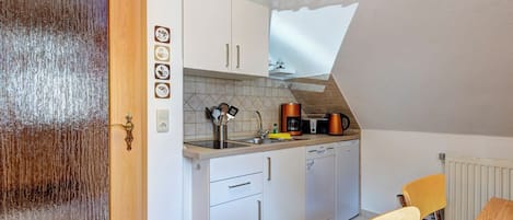 Fridge, stovetop, dishwasher, coffee/tea maker