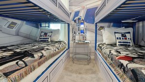 A starship-themed bedroom with bunk beds, a desk, and a R2-D2 figure. - 10251 Ebb Tide Lane (Orlando)