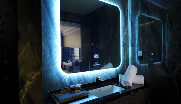 Deluxe Twin | Bathroom | Hair dryer, slippers, towels, soap