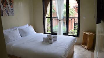 Apartment, Garden View, Poolside | Blackout drapes, soundproofing, free WiFi