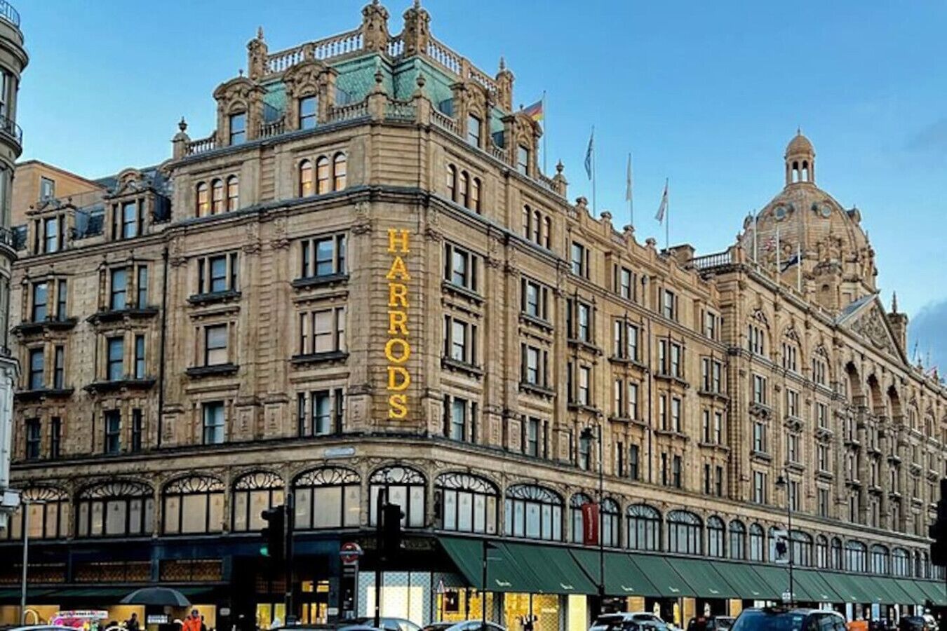 A historic building with the name 'HARRODS' prominently displayed on its facade.