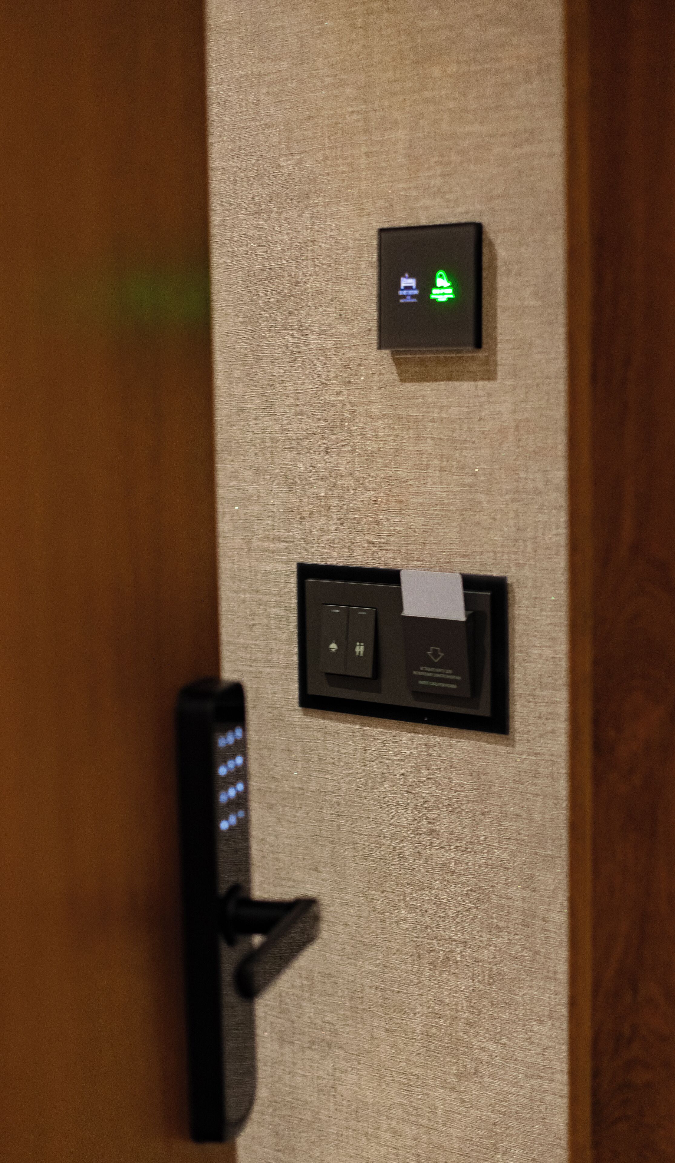 A door with a keycard reader and a lock.