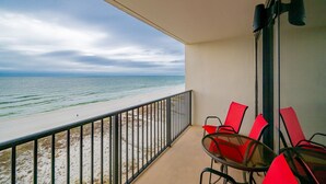 A balcony with a view of the beach and ocean. - Island Winds West 876 1 Bedroom Condo (Gulf Shores)