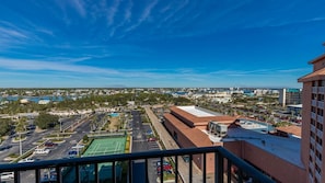 Enjoy stunning city views from the hotel's spacious balcony area overlooking a body of water.