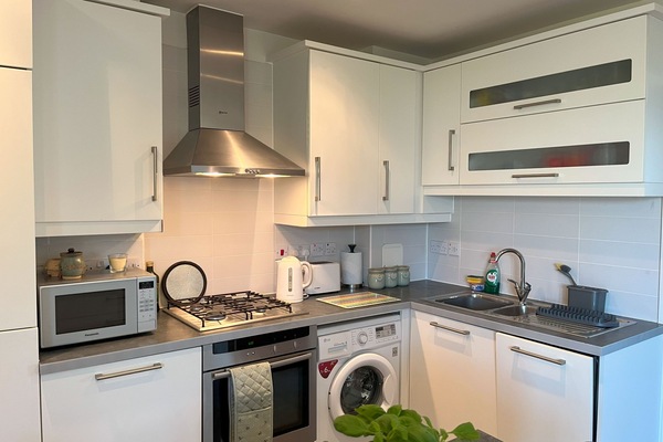 Kitchen with appliances and plenty of utencils