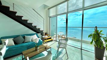 Luxury Apartment, Sea View | Living area | 25-inch flat-screen TV with cable channels