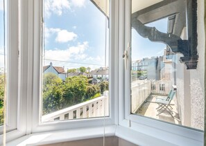Enjoy a view of the surrounding neighborhood from the comfort of your balcony.