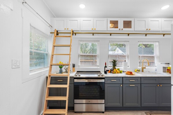 Fridge, stovetop, dishwasher, coffee/tea maker