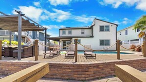 A two-story house with a pool, outdoor seating, and a covered patio area. - Bring your boat/Pool/Kayaks/Arcades (Hernando Beach)