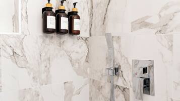 Shower, hair dryer, towels, soap