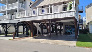 A two-story house with a covered porch and a garage. - Spacious 3 Bed/2 Bath, Sleeps 8 in Ocean Lakes!! (Myrtle Beach)