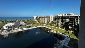A resort with multiple buildings, a swimming pool, and a view of the ocean. - Charming 2-bedroom condo with AC, fitness room in wonderful Longboat Key (Longboat Key)