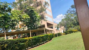 A grassy area with a building in the background.